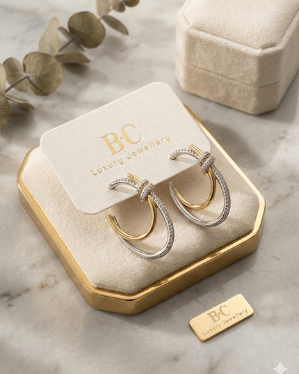 Dual-Tone Knot Hoop Earrings – Gold & Silver Sparkle
