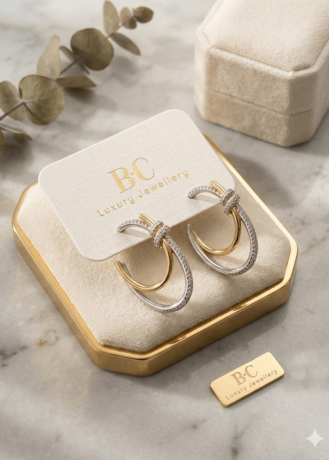 Dual-Tone Knot Hoop Earrings – Gold & Silver Sparkle